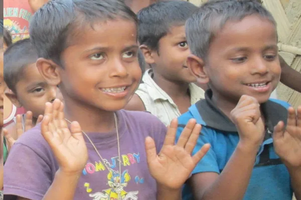 Two smiling boys at the school