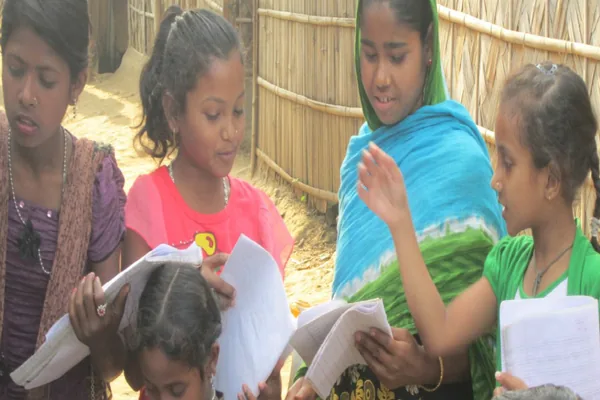 Children learning to write at the school