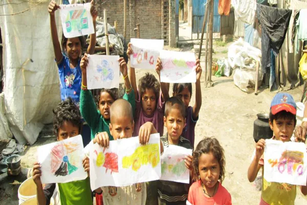 Children showing their drawings