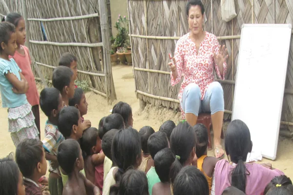 Teacher at the whiteboard with the children