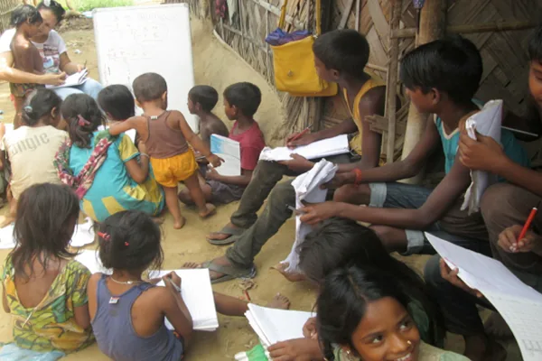 Pupils writing in their notebooks